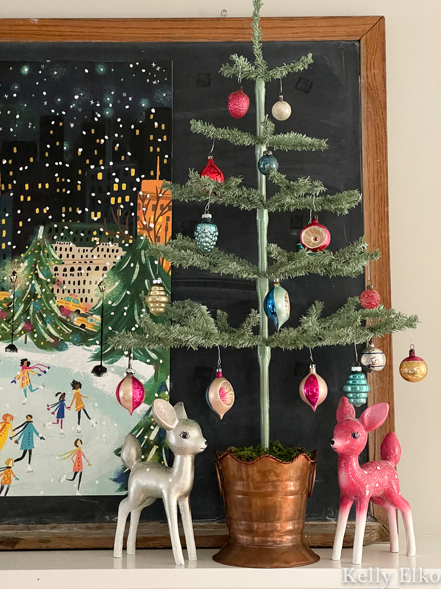 Whimsical Christmas decor - love the feather trees with vintage ornaments and the retro deer kellyelko.com