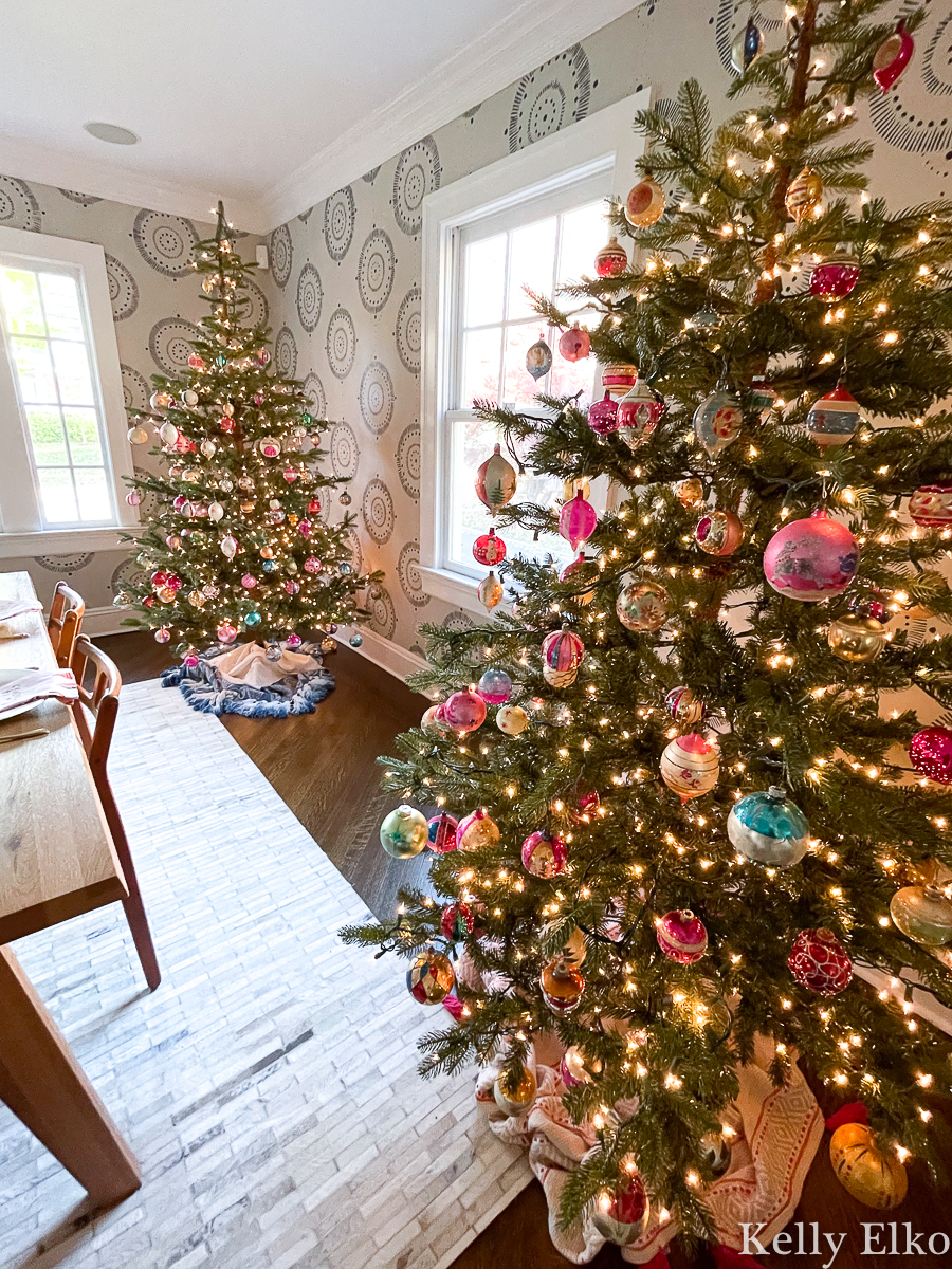 Beautiful pair of sparse Christmas trees filled with vintage glass ornaments kellyelko.com