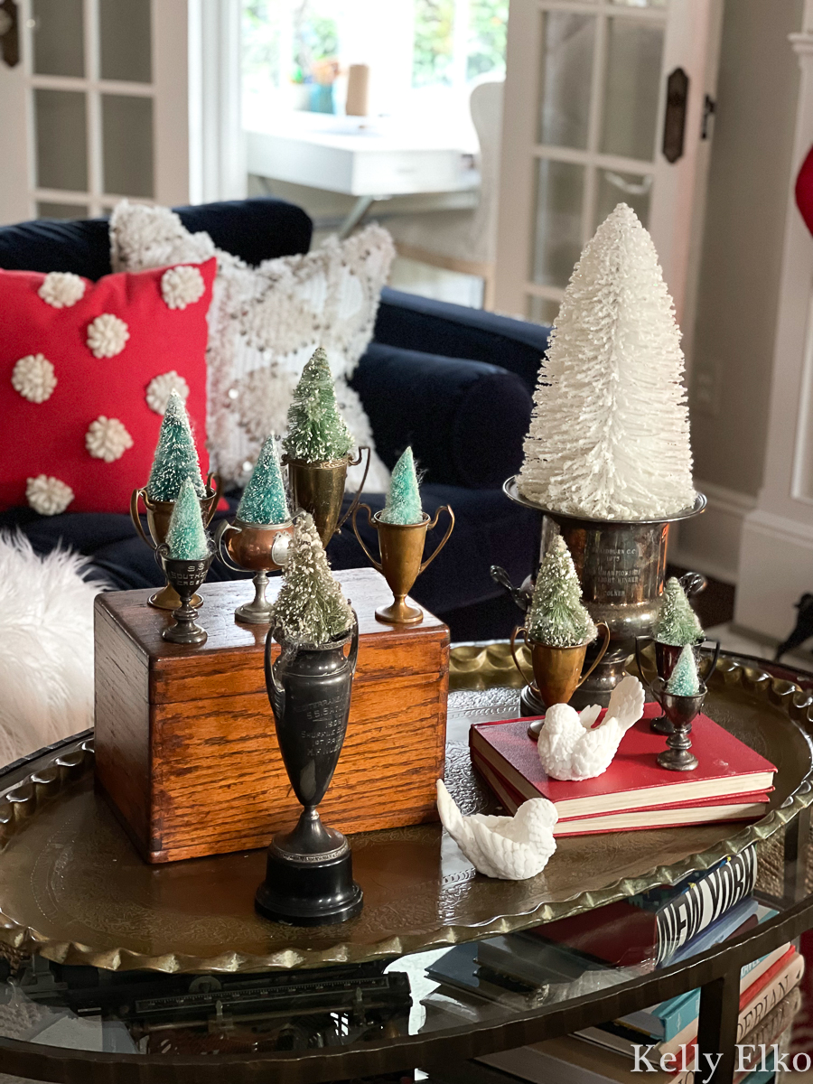 Vintage bottle brush trees displayed in old trophies kellyelko.com