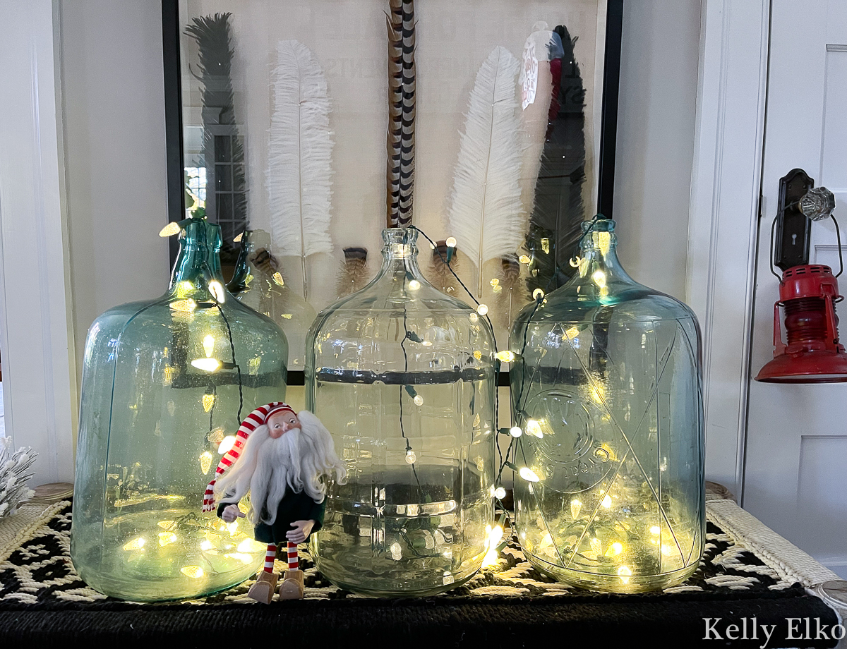 Love these old water jugs filled with string lights for Christmas kellyelko.com