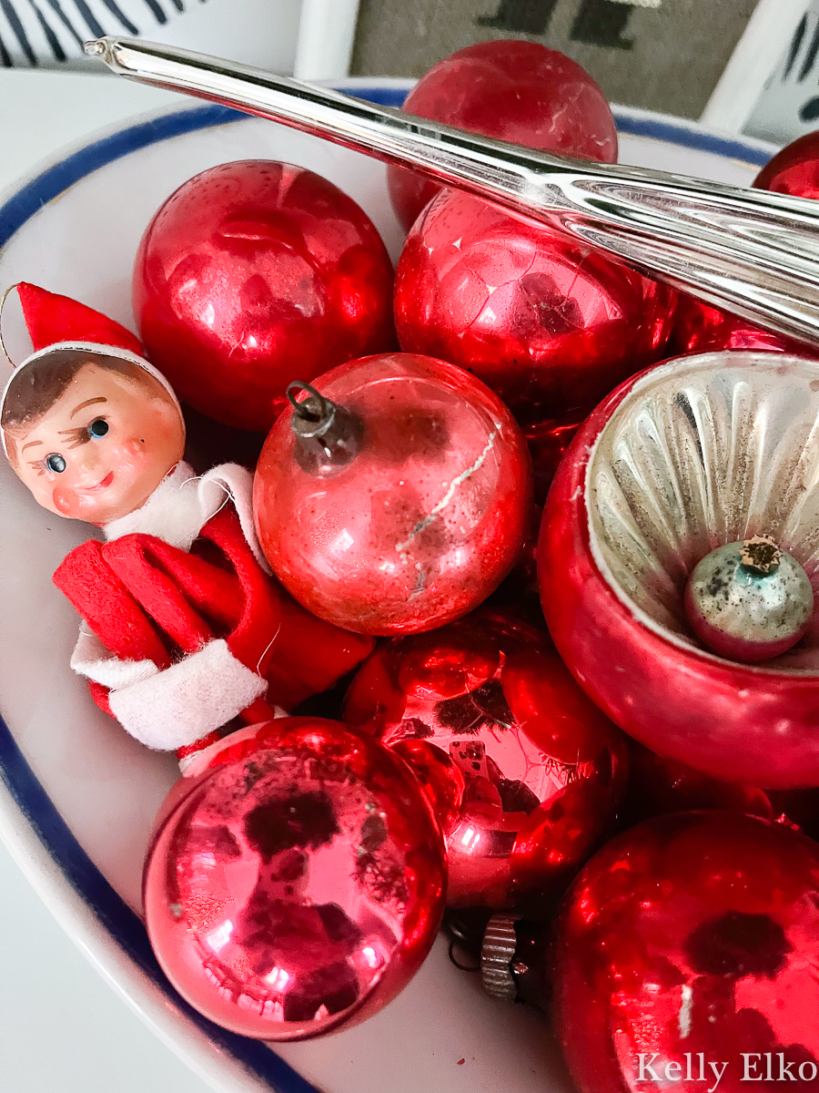 Tiny elf knee hugger hides among vintage ornaments kellyelko.com