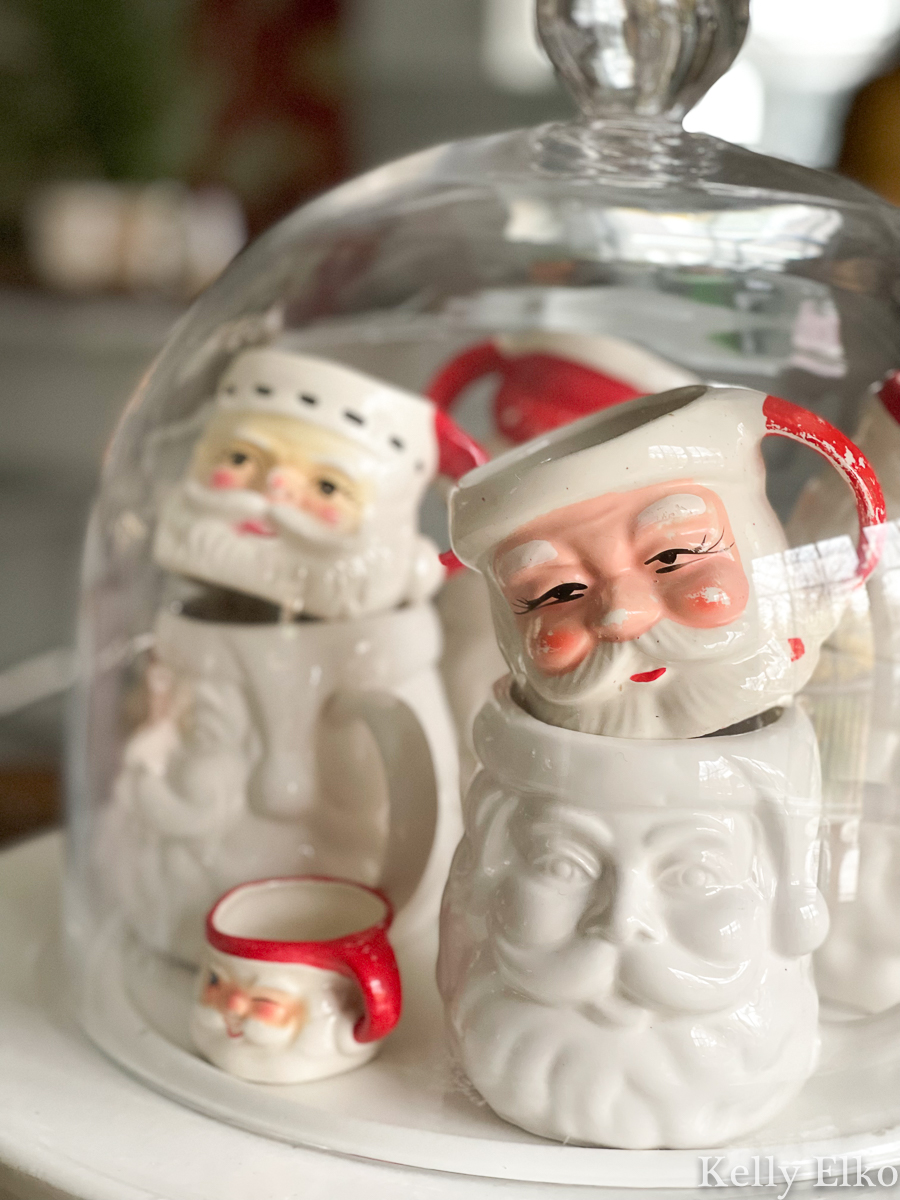 https://www.kellyelko.com/wp-content/uploads/2021/11/vintage-santa-mugs-under-glass.jpg