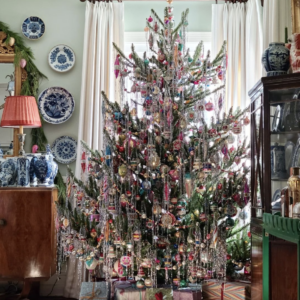 The best tinsel covered trees - love this beautify dripping with tinsel and vintage Shiny Brite ornaments kellyelko.com