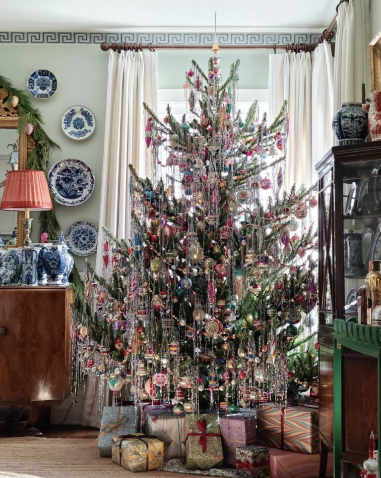 The best tinsel covered trees - love this beautify dripping with tinsel and vintage Shiny Brite ornaments kellyelko.com