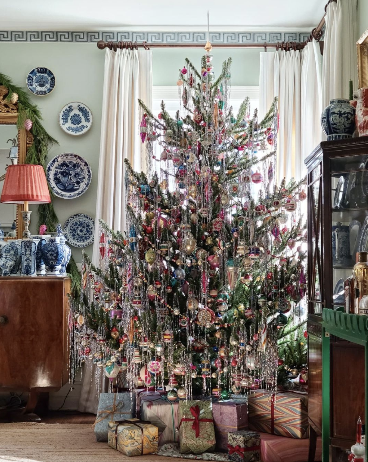 The best tinsel covered trees - love this stunning Christmas tree dripping with tinsel and vintage Shiny Brite ornaments kellyelko.com