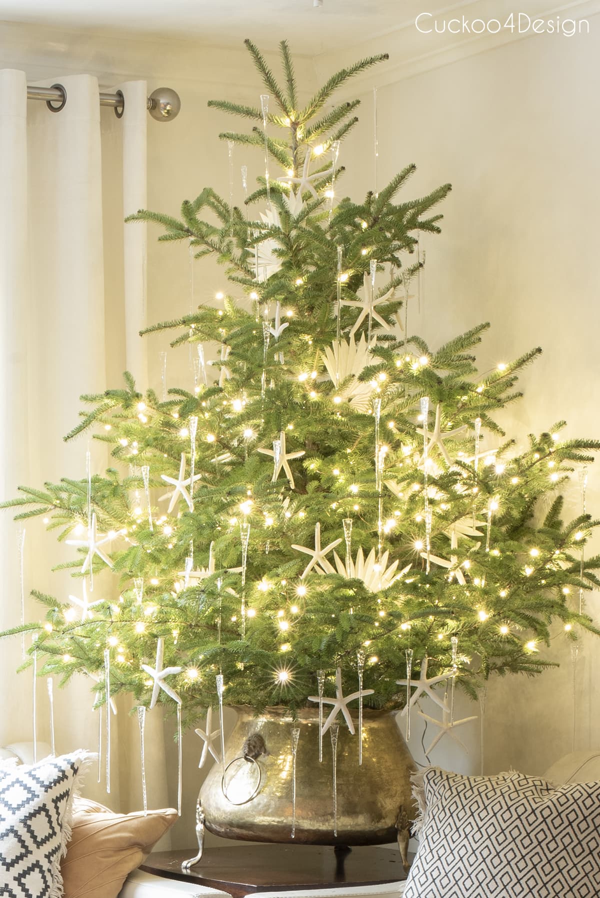 Stunning Christmas tree dripping in icicle ornaments and fairy lights 