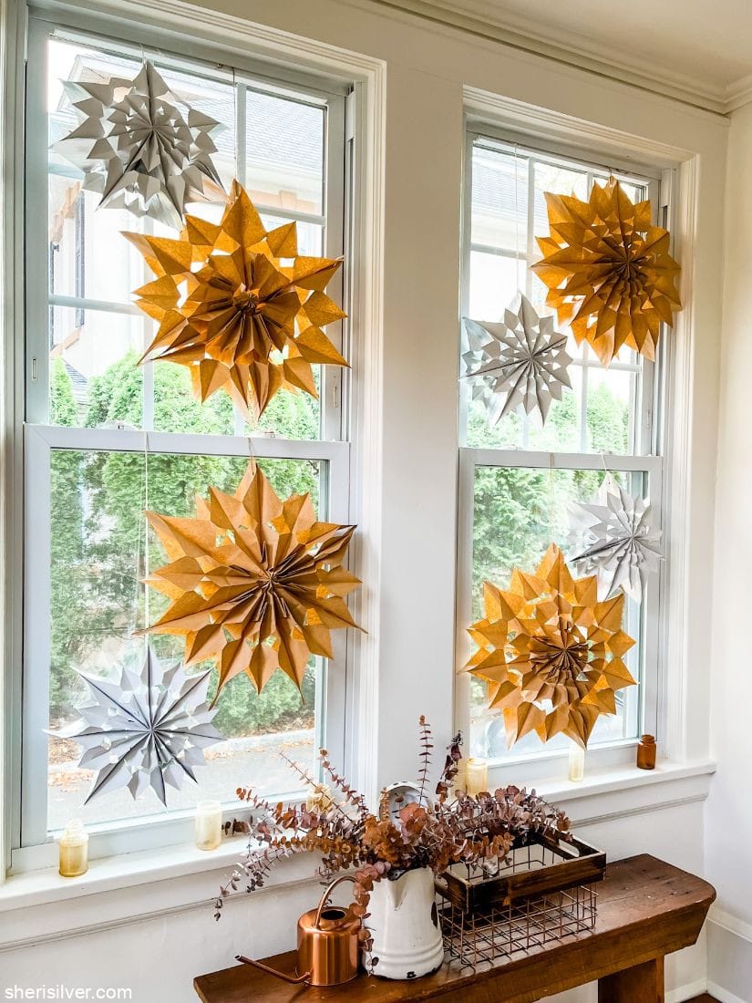 Beautiful DIY paper bag snowflakes are stunning in a window 