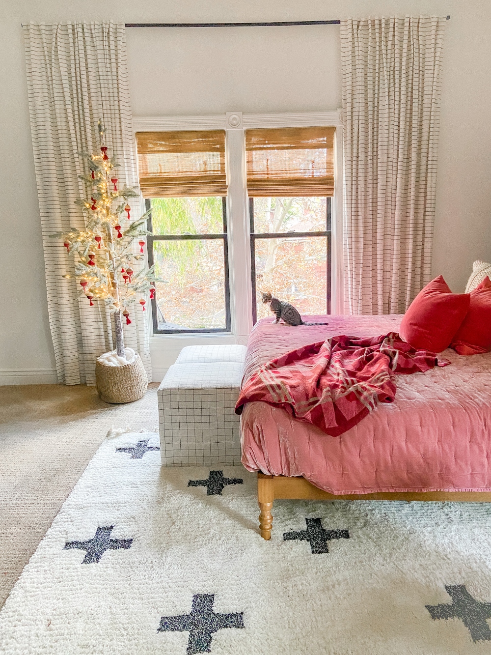 Pink boho bedroom with Christmas tree 
