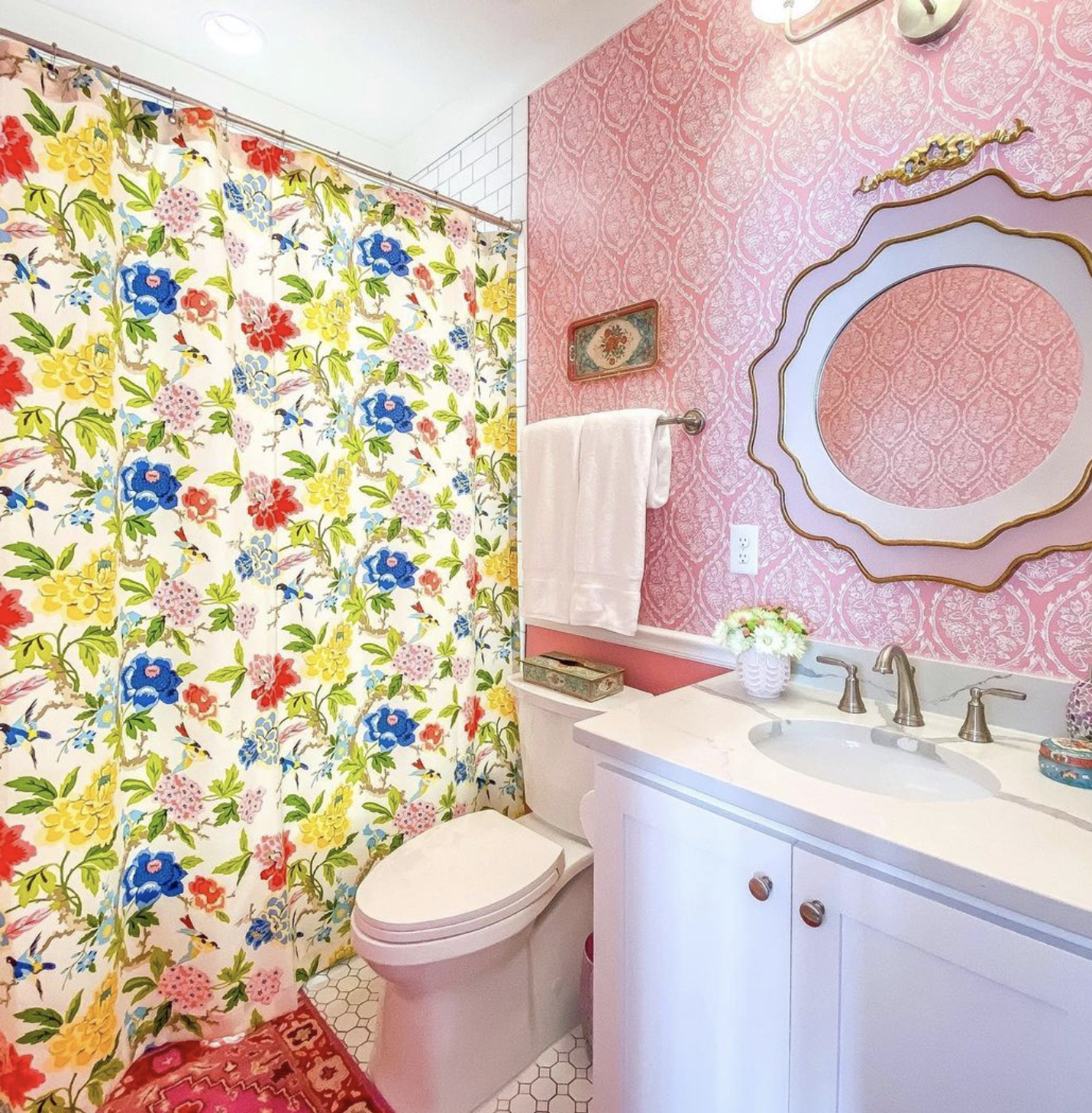 Pink bathroom with floral shower curtain - so much fun! kellyelko.com