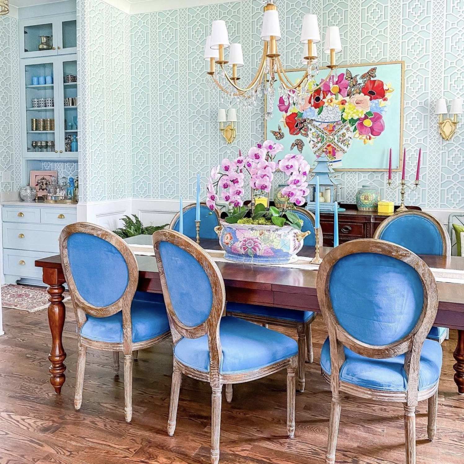 Blue dining room with traditional wallpaper, velvet chairs and brass chandelier kellyelko.com