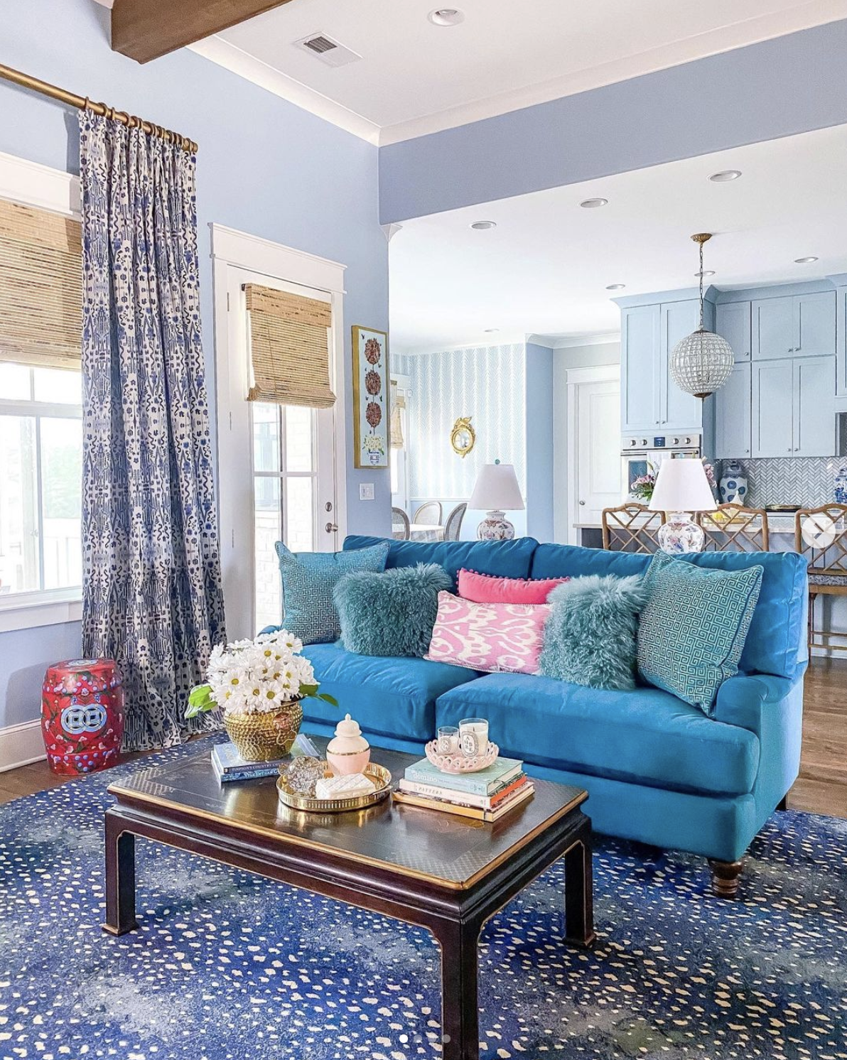 Love all the blue in this room from the paint to the curtains to the velvet sofa and rug kellyelko.com