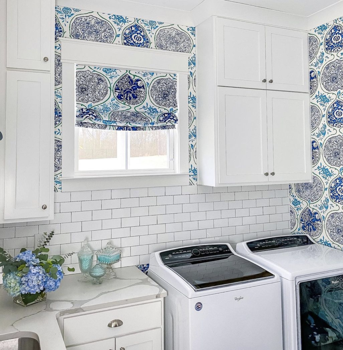Beautiful blue and white laundry room with subway tile kellyelko.com
