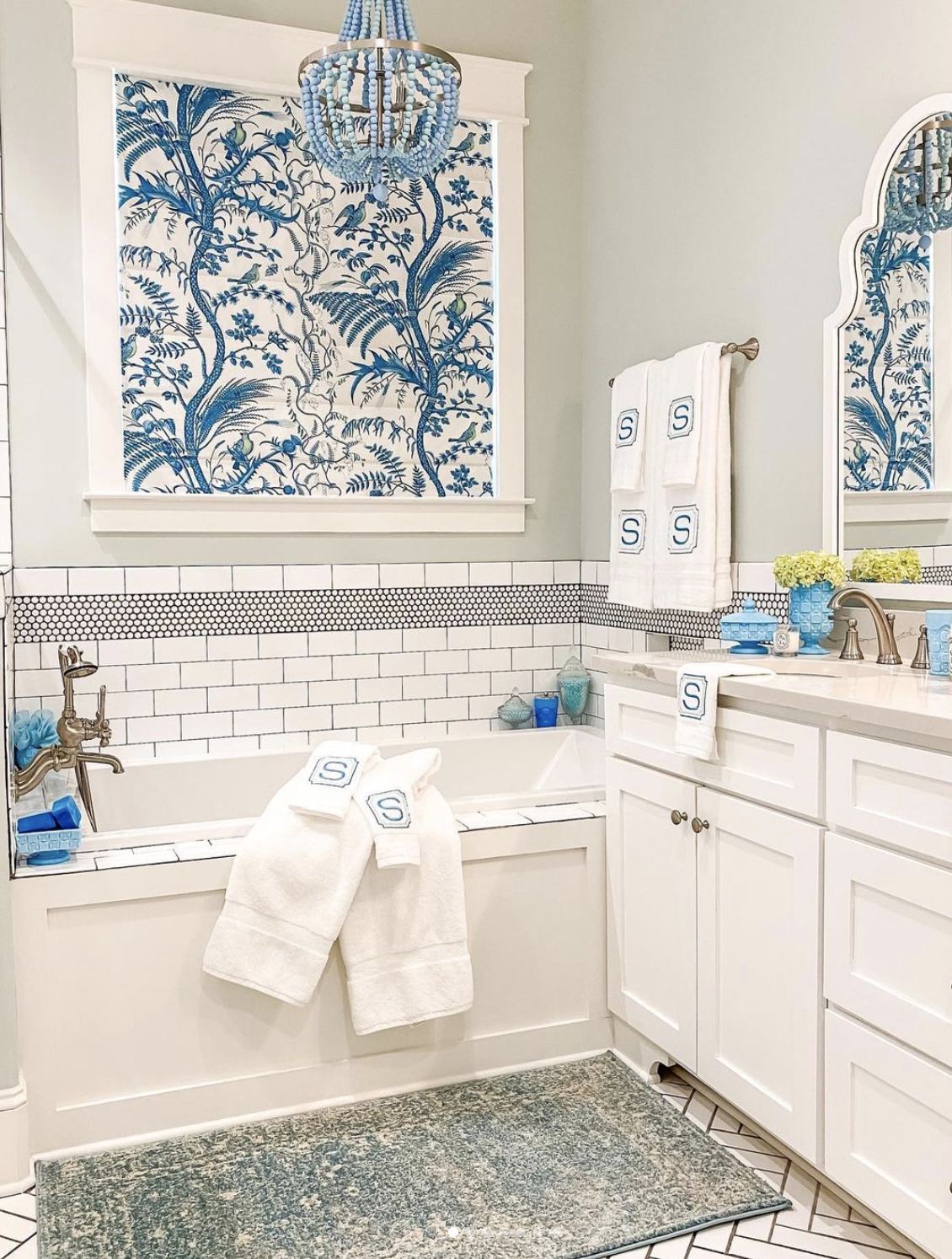 Gorgeous traditional blue and white bathroom with drop in tub kellyelko.com