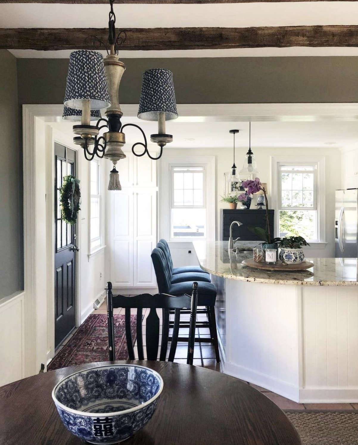 White farmhouse kitchen with wood ceiling beams kellyelko.com