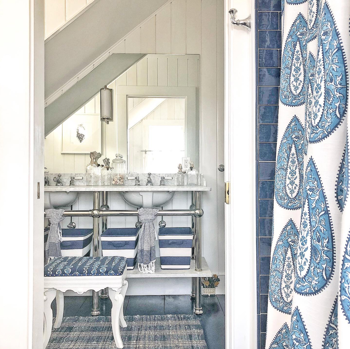 Beautiful blue and white bathroom with marble vanity and blue wood painted floors kellyelko.com