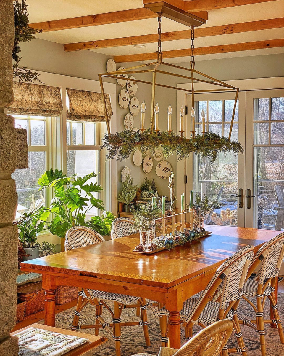Cottage style - love the wood ceiling beams, statement chandelier and pine table with bistro chairs kellyelko.com
