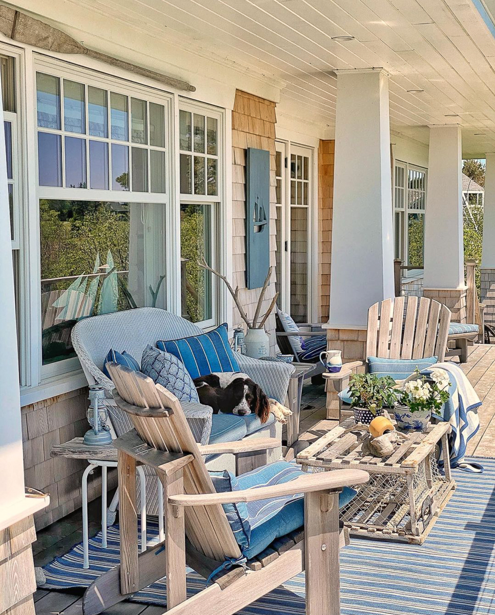 Coastal porch with adirondack chairs and wicker furniture kellyelko.com