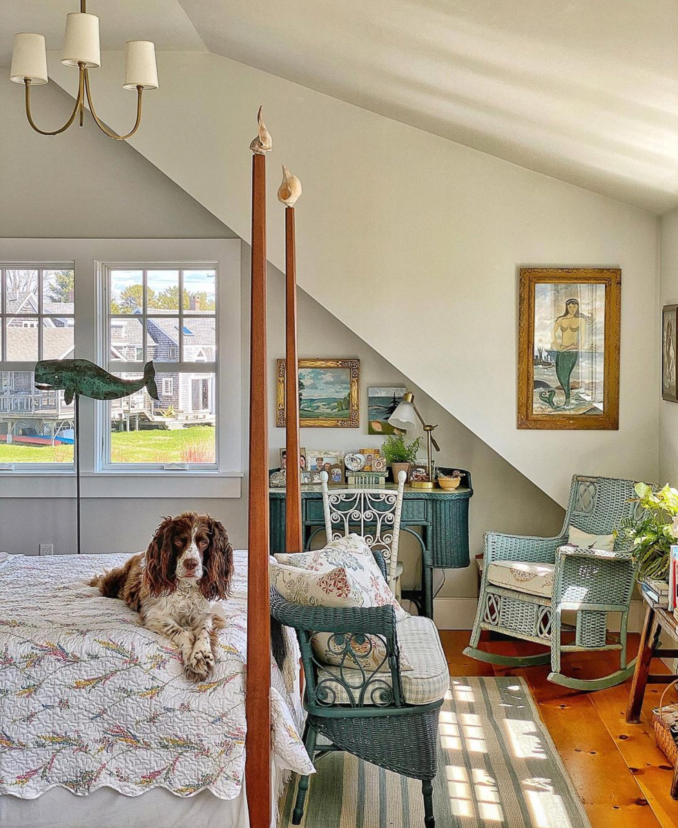 Coastal bedroom with four poster bed and wicker furniture kellyelko.com