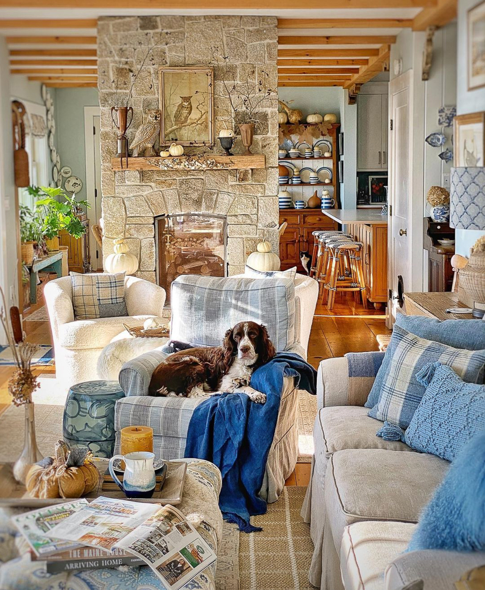 Coastal cottage with blue and white furniture and a stone fireplace kellyelko.com