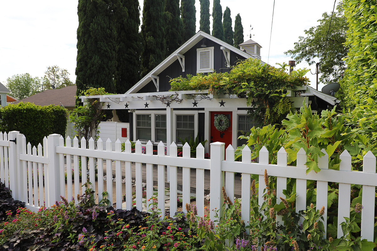 Charming 1908 cottage with picket fence, and vine covered pergola 