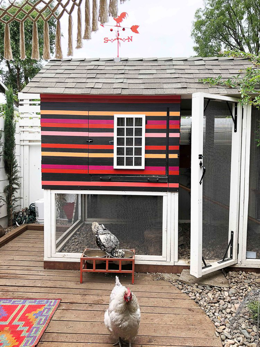 Colorful chicken coop with weathervane