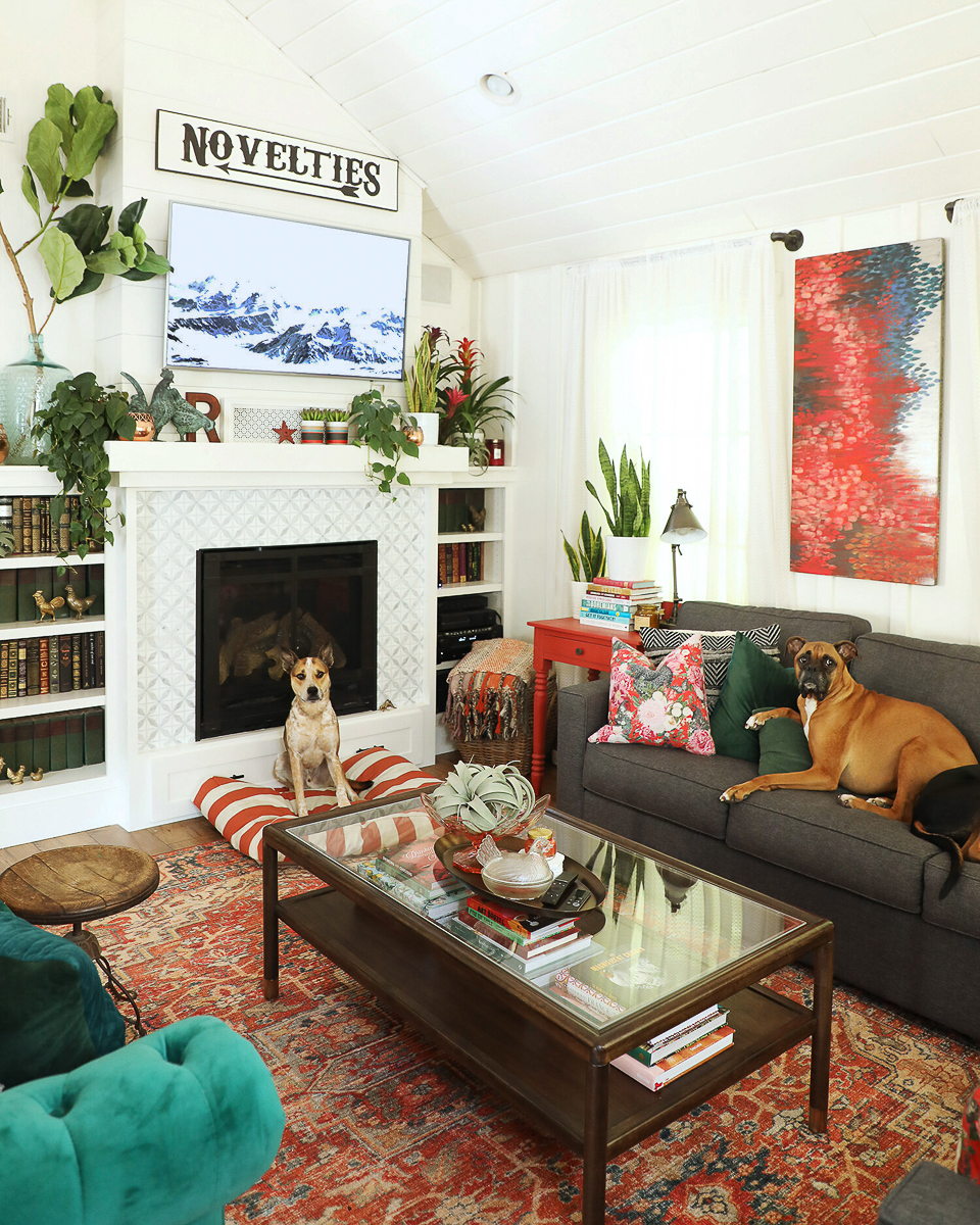 Cozy cottage family room with colorful rug and art 