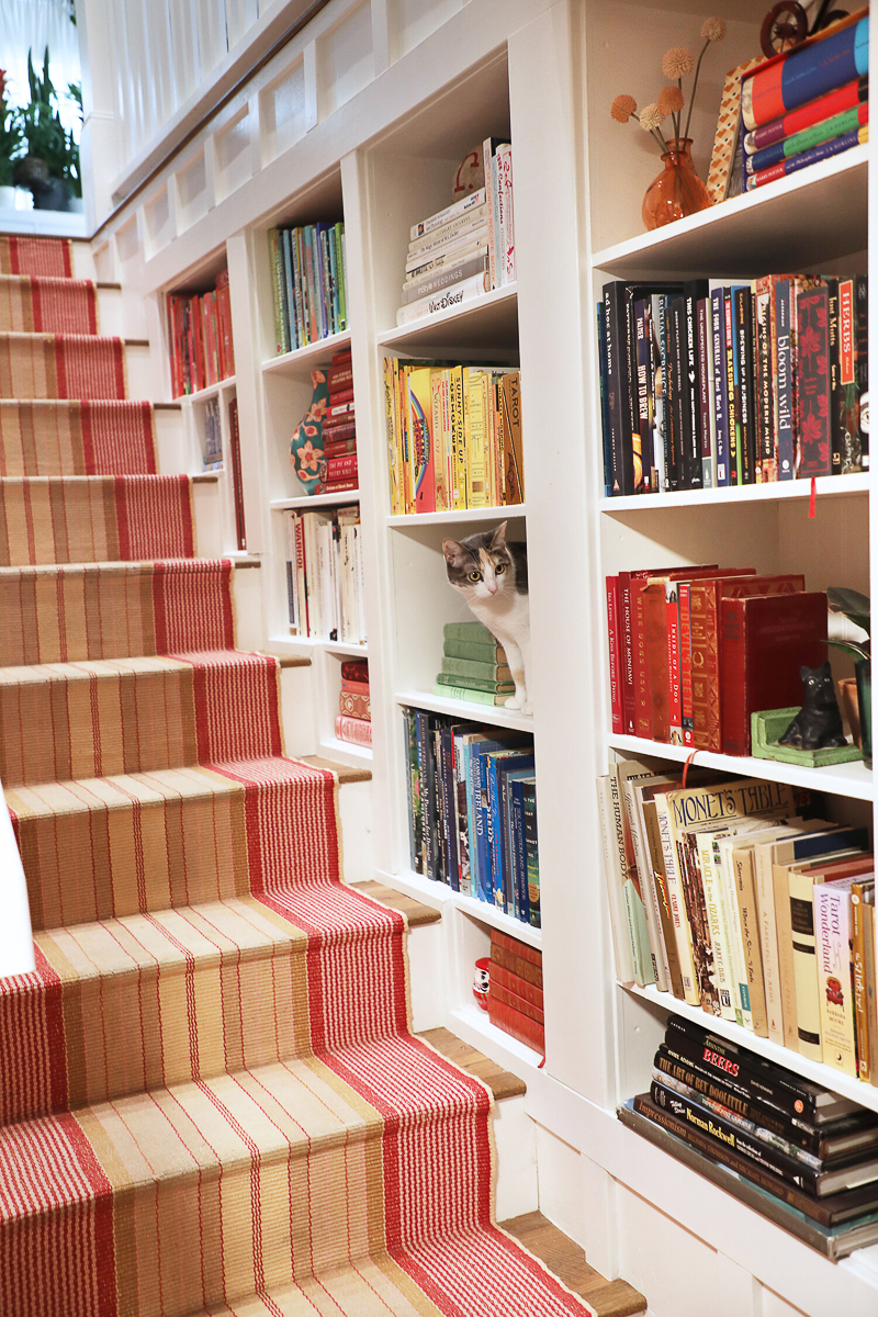 Love these built in bookcases on the staircase wall