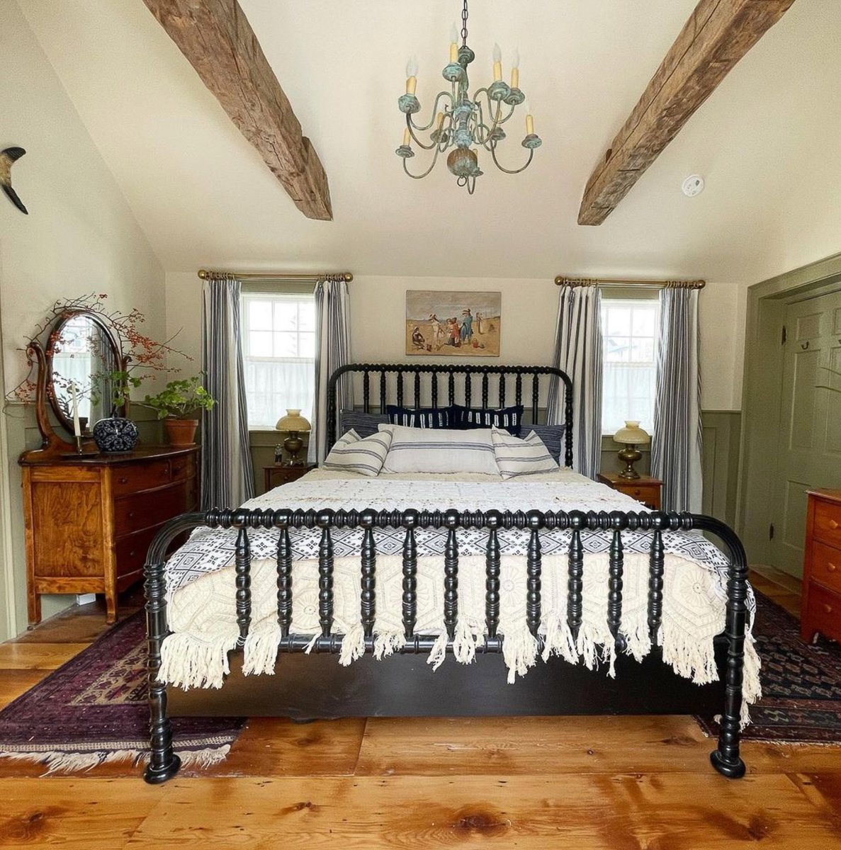 Love this Jenny Lind bed painted black and in this antiques filled bedroom