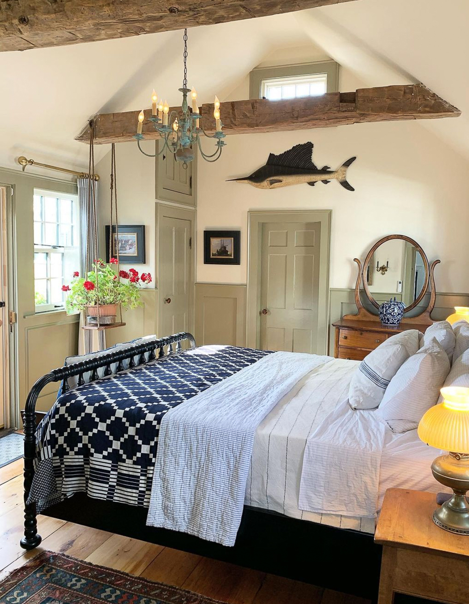 Light and bright bedroom with soaring ceilings and wood beams 