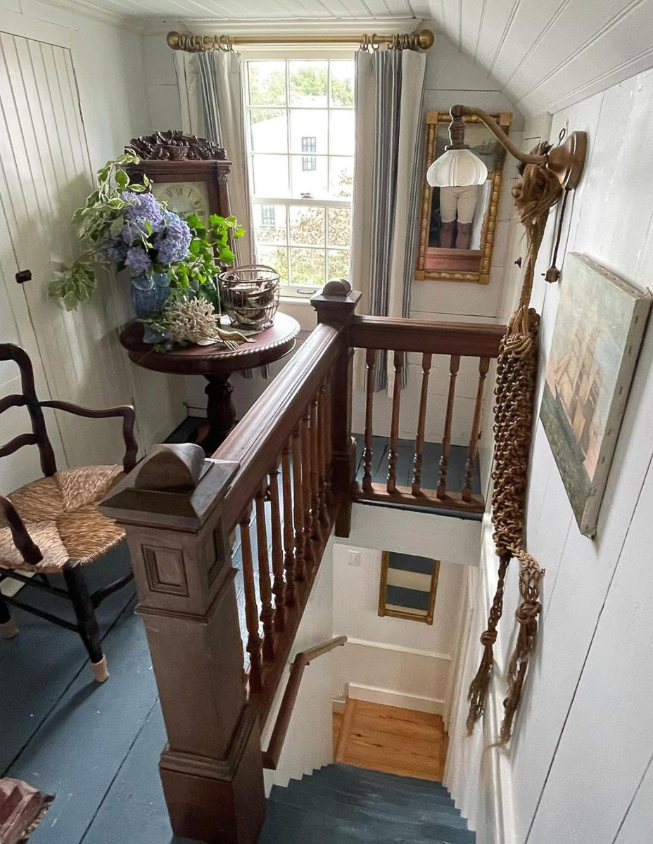 Charming old home with steep staircase and antique filled landing 