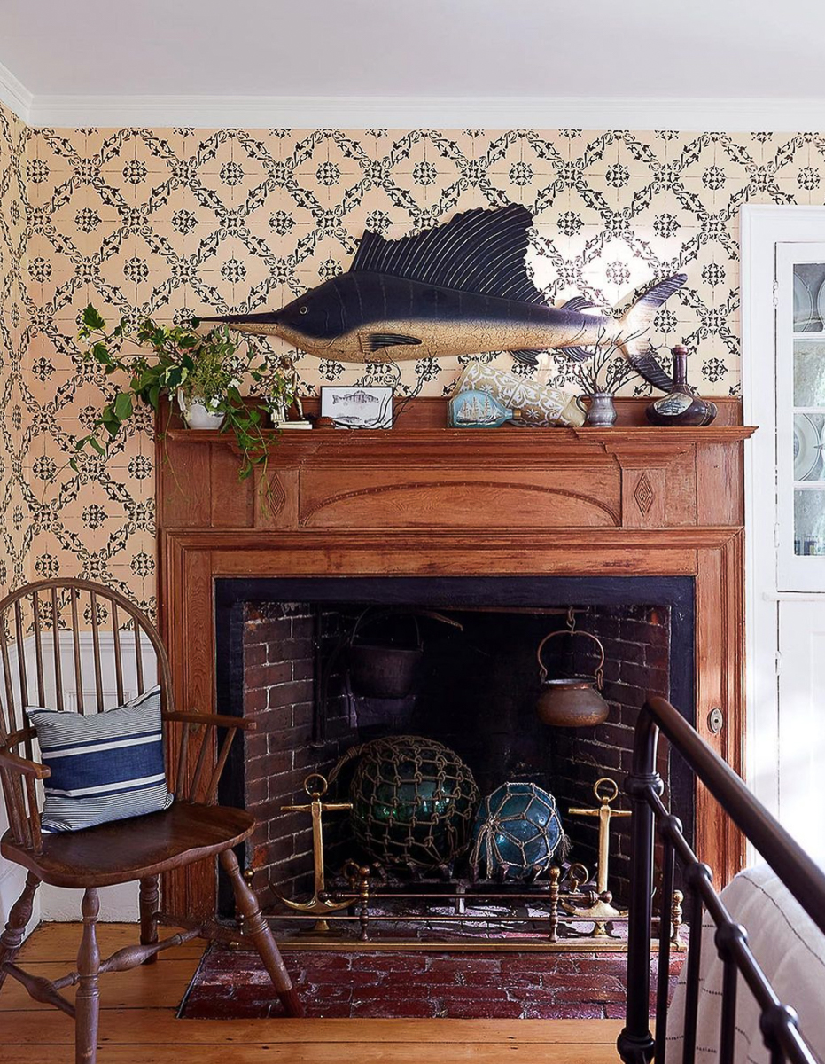Antique Rumford fireplace with a fun swordfish hanging above 