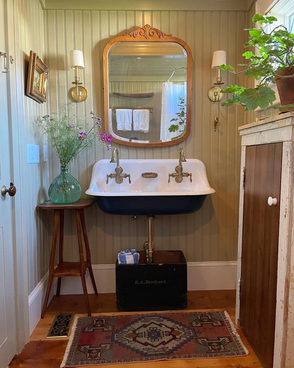 Schoolhouse sink with antique wood mirror above and I love the wainscotting 