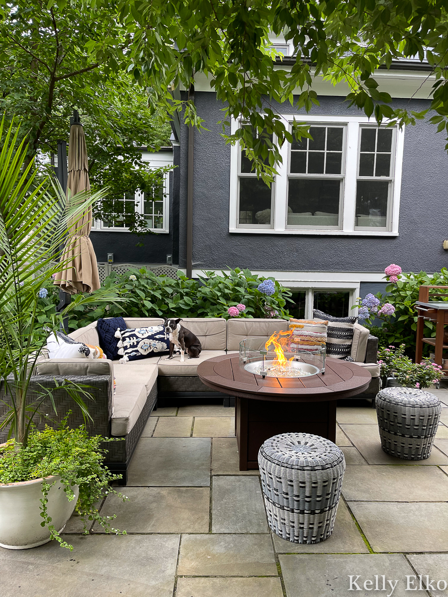 Love this POLYWOOD fire pit on this beautiful patio with hydrangeas and palm trees kellyelko.com