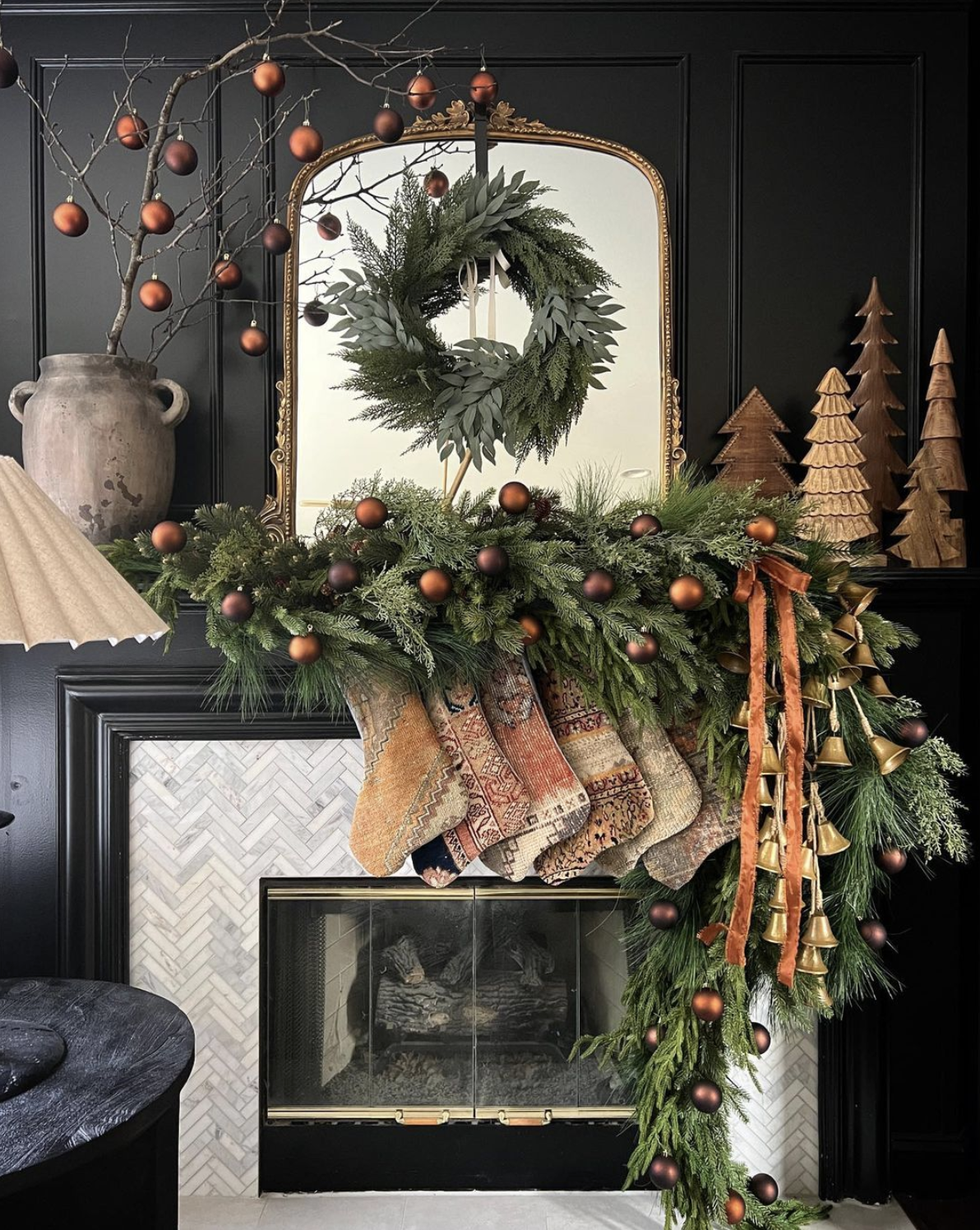 Stunning bronze and copper Christmas mantel with Turkish rug stockings 