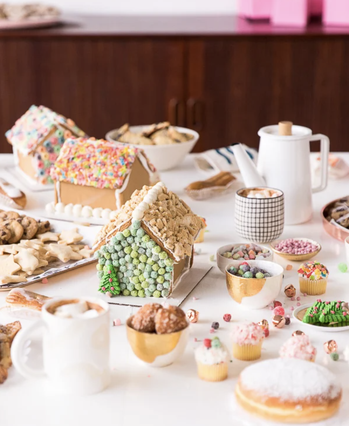 Throw a gingerbread house decorating party and use colorful cereal to decorate them