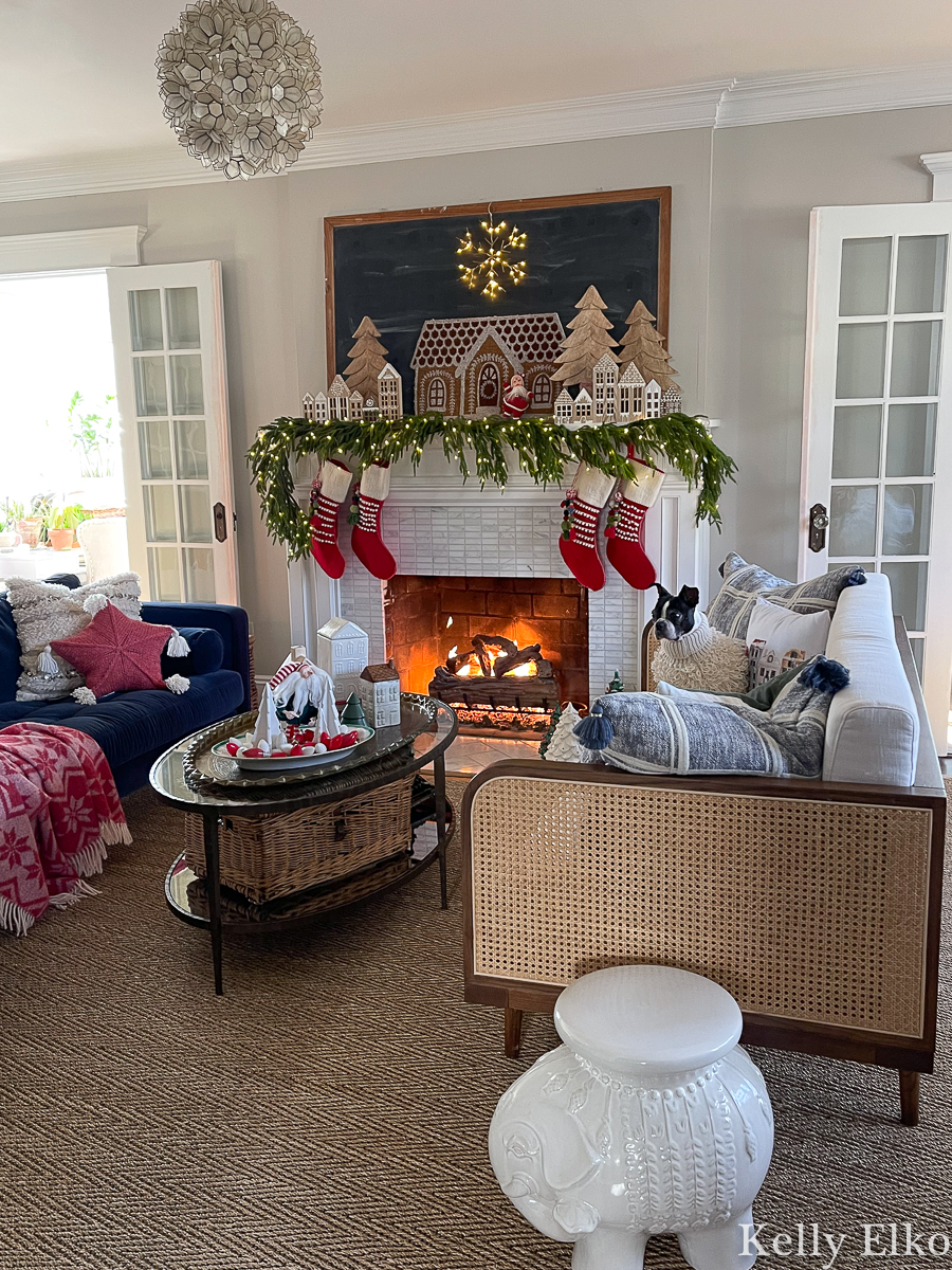 Wow! What an amazing Christmas mantel! Love the wood houses and the giant gingerbread house, the realistic garland, fairy lights and vintage surprises kellyelko.com