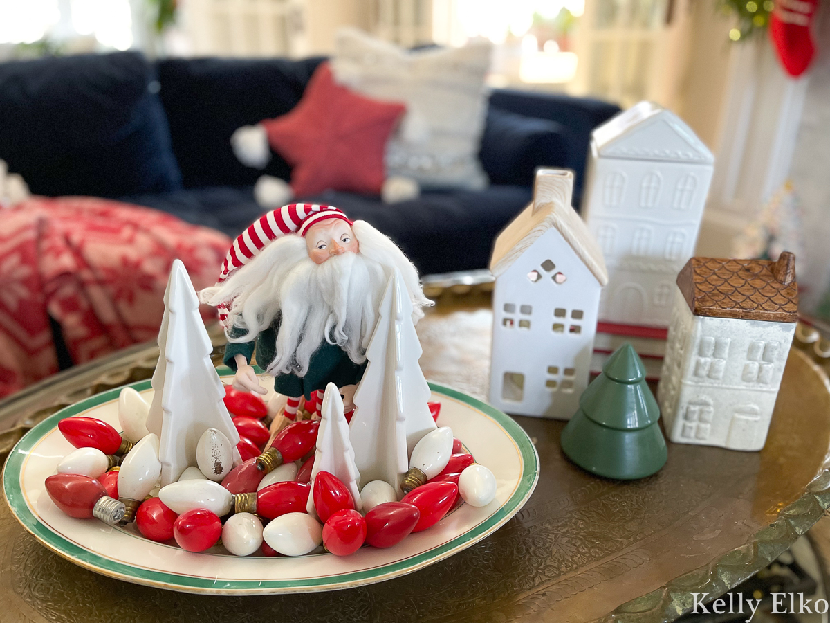 Cute Christmas coffee table display - love the vintage tree lights and ceramic houses kellyelko.com