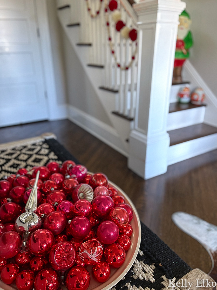 Love this huge bowl of red vintage ornaments kellyelko.com