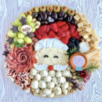 Unique Christmas Charcuterie Board kellyelko.com - love this Santa face board