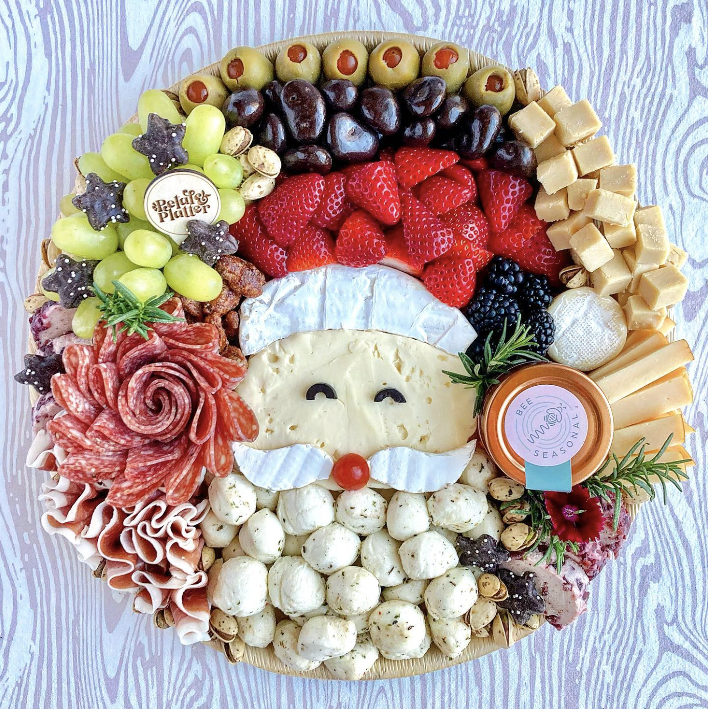 Unique Christmas charcuterie board - love this Santa board of brie cheese 