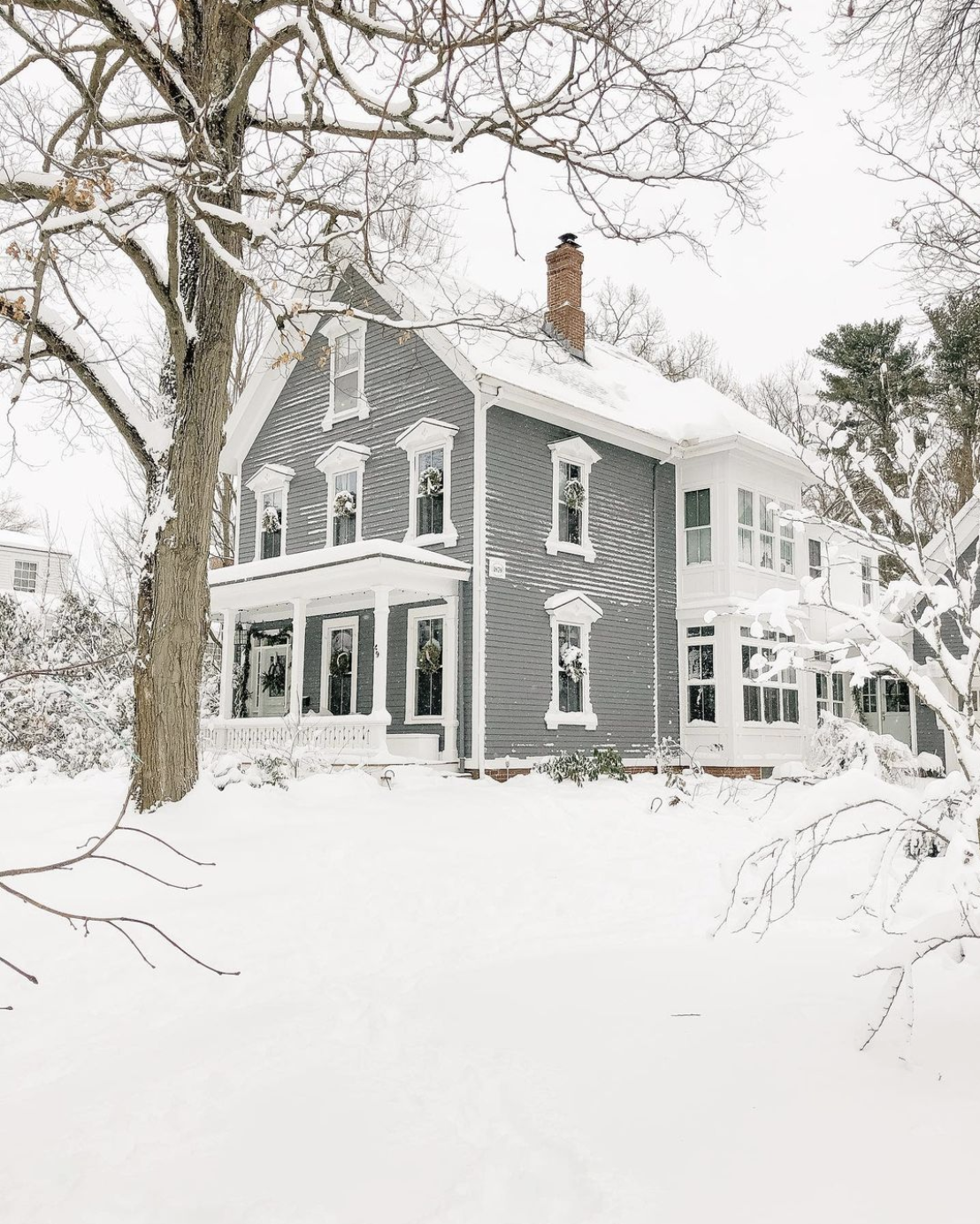 1879 home blanketed in snow 