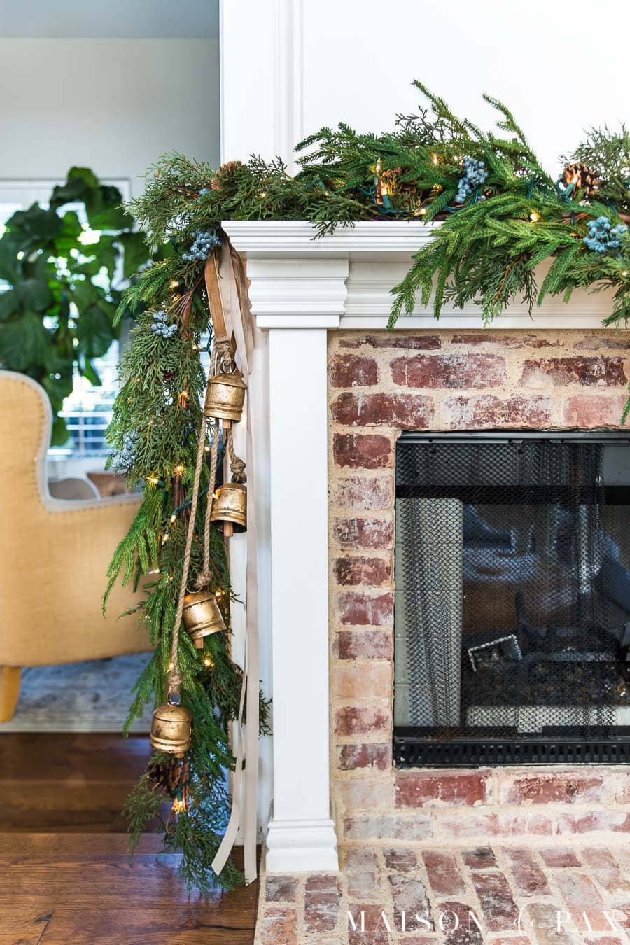 Love this Christmas mantel with cascading brass bells