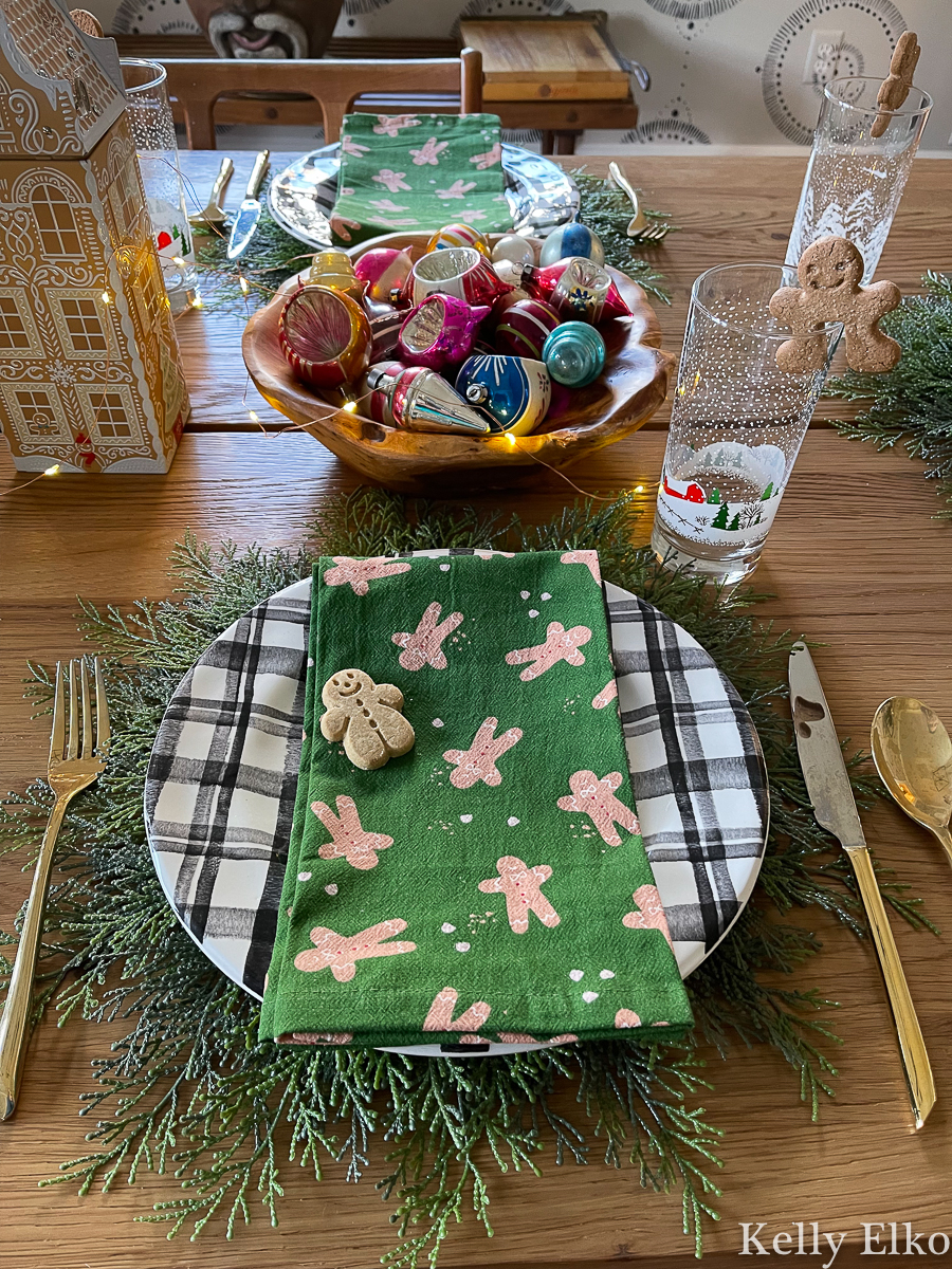 Fun and festive gingerbread theme table with the cutest gingerbread men napkins kellyelko.com