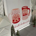 DIY Gift Bag Framed Art - love this fun Santa and Mrs Claus mug art kellyelko.com