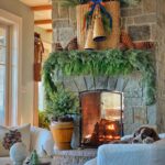 Brass Bells Christmas Decor Ideas - love this stunning mantel with natural greenery, vintage basket with brass bells and huge pinecones