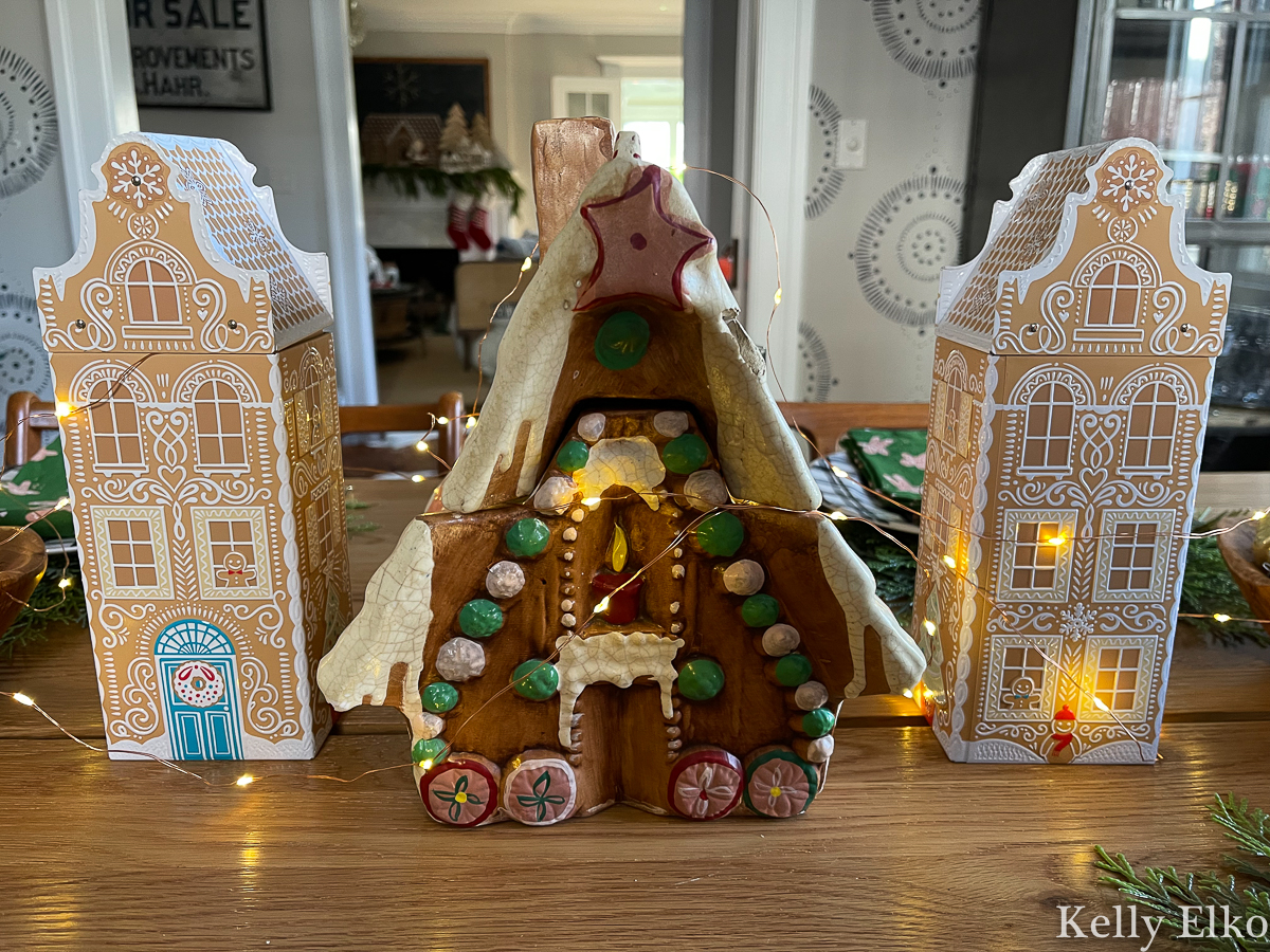 Love this fun gingerbread house centerpiece with vintage cookie jar and musical Marks and Spencer gingerbread tins kellyelko.com