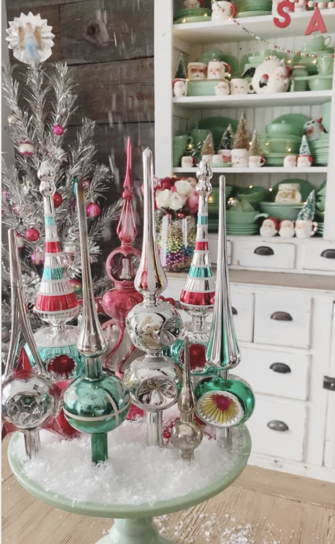 Vintage Christmas tree toppers on a jadeite cake stand / kellyelko.com