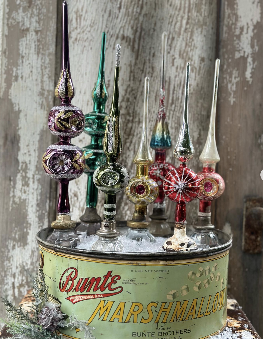 Display vintage Christmas tree toppers on antique doorknobs / kellyelko.com