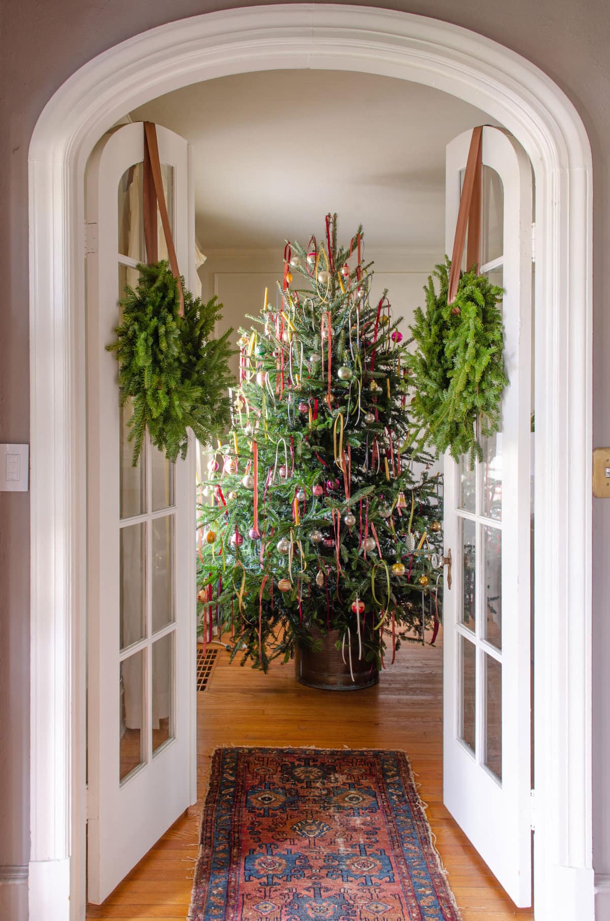 Ribbon Bow Trees - love these Christmas trees dressed up with ribbon bows / kellyelko.com