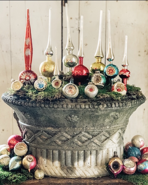 Vintage tree toppers displayed in a planter / kellyelko.com